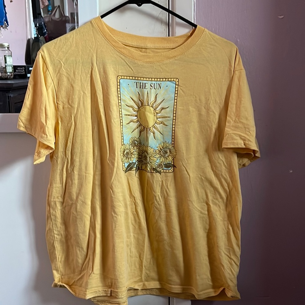 Yellow T-shirt with the sun on it